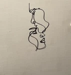 Metal Couple Facial Outlining Wall Decor. Fixed Price $32.00.