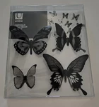 Umbra Chrysalis Wall Decor Mural Butterflies 16 Piece 4-DESIGNS Stick On Black. Fixed Price $14.99.