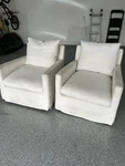 Two White Swivel Chairs From World Market. Fixed Price $500.00.