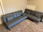 Used Flamaker Futon Sofa Bed - Modern Faux Leather Couch. Fixed Price $249.00.