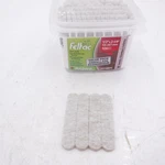 100 Pack Feltac 1/2" X 2-5/8" Adhesive Pad Strips Beige. Fixed Price $50.00.