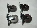 (4) New Designer Wooden Swivel 3" Casters Walnut Clear Rings Black Yoke 110LB. Fixed Price $23.73.