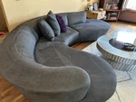 Curved Gray Microfiber Chaise Sofa Armless Modern With Cushions Seats 6+. Fixed Price $1200.00.