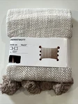 New Ikea Andmatmott Cushion Cover Natural 16X23" With Pomps. Fixed Price $22.99.