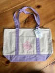 Trader Joe's New Limited-edition Large Canvas Tote Bag With Lavender Handles. Fixed Price $500.00.
